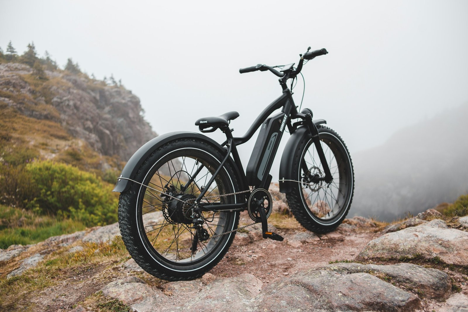 Fat-tire electric bike parked on rocks